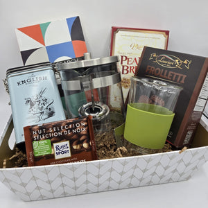 Infuser Teapot Basket basket with selection of tea, infuser teapot, ceramic mug, puzzle book and sweet treats.