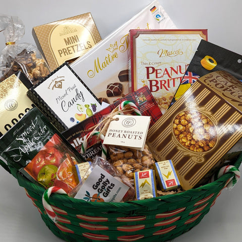 Holiday basket with a variety of sweet treats in a festive basket.