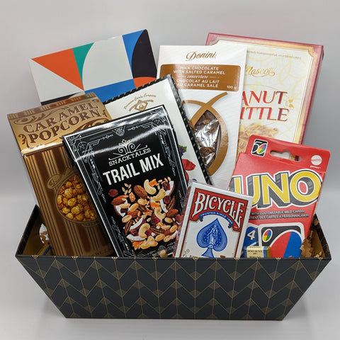 Fun and Games Basket with Uno, a wordsearch puzzle book, and tasty, shareable snacks!