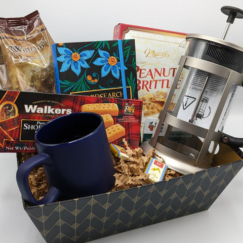 French Press Basket with a coffee French press, coffee, mug, puzzle book, and treats.