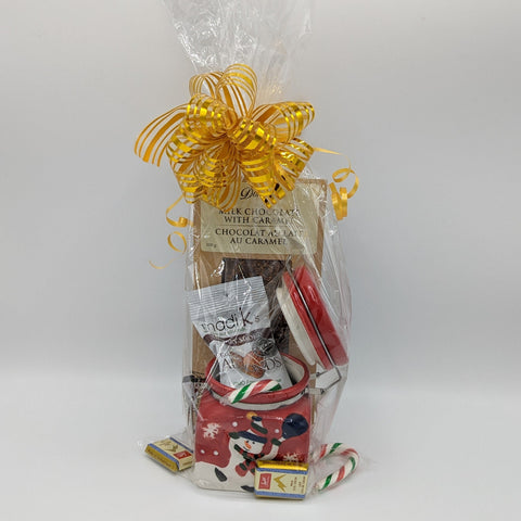 Festive jar gift with Donini gourmet chocolate bar, hickory almonds, and candies, wrapped in cello.
